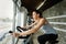 Young beautiful woman doing indoor biking exercise