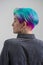 Young beautiful woman with dyed blue and green hair. Pixie bob short haircut The concept of hair styling.