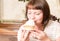 Young beautiful woman eating a dessert. Sweet life with cake