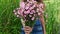 Young beautiful woman give pink flowers bouquet as gift