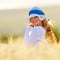 Young beautiful woman on golden cereal field