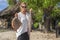 Young beautiful woman on holding fresh caught sea fish and small stingrays in her arms at a local food market on the island of