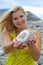 Young beautiful woman holding pebble stone