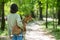 A young beautiful woman holds a dog in her arms for a walk. non-barking african basenji dog.