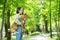 A young beautiful woman holds a dog in her arms for a walk. non-barking african basenji dog.