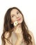 A young beautiful woman holds a flower chamomile