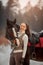 Young beautiful woman with horse outdoor portrait at spring day