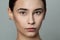 Young beautiful woman without makeup cosmetics portrait. Face closeup, real skin