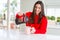 Young beautiful woman making morning coffee smiling, preparing a cup of latte for breakfast