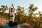 Young beautiful woman meditating in the Park. The concept of yoga, sports and meditation