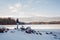 Young beautiful woman posing near winter lake