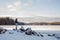 Young beautiful woman posing near winter lake