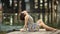 Young beautiful woman posing on a wooden river pier.