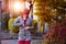 Young beautiful woman preparing for workout training. Autumn running fitness girl in city urban park environment with