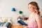 young beautiful woman reading book at home in cozy weekend morning