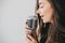 Young beautiful woman sing in vintage microphone.