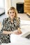 Young beautiful woman sitting on the floor working on laptop.