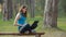 Young beautiful woman speaking and working using laptop in nature