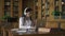 Young beautiful woman studying topic, sitting at table with laptop in library.