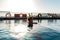 Young beautiful Woman sunbathing in swimming pool at luxurious looking on sunshade parasol in Egypt Luxor