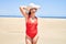 Young beautiful woman sunbathing wearing summer swinsuit at maspalomas dunes bech