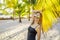 Young beautiful woman in swimsuit on tropical beach, summer vacation, palm tree leaf, tanned skin, sand, smiling, happy