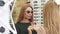 Young beautiful woman trying sunglasses shopping with her friend