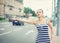 Young beautiful woman trying to hail a cab in the city