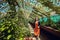 Young beautiful woman walking on greenhouse in Botanical Garden of the University, Wroclaw, Poland