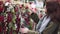 A young beautiful woman walks around the store and selects Christmas decorations and decorations to celebrate the New