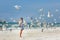 Young beautiful woman watching the seagulls flying