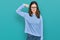 Young beautiful woman wearing casual clothes and glasses strong person showing arm muscle, confident and proud of power