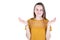 Young beautiful woman in yellow shirt holding two imaginary object on both palm isolated on white background