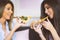 Young beautiful women eating slices of tasty Italian pizza at home - Happy pretty ladies enjoying a quick meal together