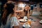 Young beautiful women having coffee and feeling joyful in cafe