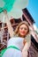 Young beauty against Eiffel Tower, girl with balloons