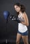 Young beauty woman boxer fighting with punch