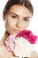 Young beauty woman with flower peony pink closeup makeup soft tender gentle look