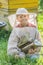 Young beekeeper with painted wooden beehives