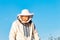 Young beekeeper working in the apiary. Beekeeping concept. Beekeeper harvesting honey