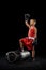 Young beginner boxer, sportive boy training isolated over dark background. Concept of sport, movement, studying