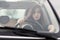 Young beuatiful woman driving a car