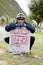 Young bicycle man at destination sign