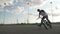 Young biker losing balance in mid air while landing on his bicycle and falling -