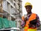 Young black African man construction worker holding clipboard wh