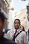 Young black businessman walking in a busy London street looking ahead, close up, vertical