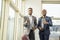 Young black businessmen standing together giving thumbs up