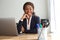 Young black businesswoman sitting at office desk