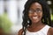 Young black businesswoman wearing glasses, close up