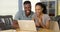 Young black couple browsing internet on laptop together